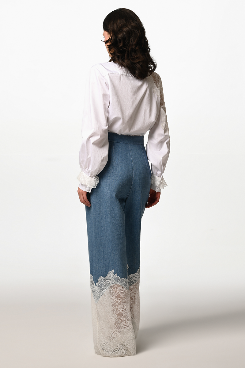 Liya Lace Reverie Shirt in denim, featuring intricate lace details and a relaxed fit, displayed on a hanger.