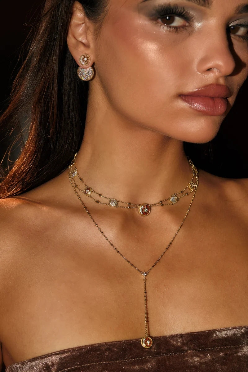 Gold Desert Tale Necklace by Velvet Desert featuring intricate desert-inspired pendant on a delicate chain.