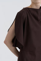 Close-up of the JINSUN Filante wool brown jumpsuit showing textured fabric and detailed stitching.