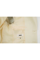 Close-up of JINSUN printed wool silk jacket in pale yellow, showcasing the fabric texture and detailed design.