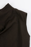 Close-up of JINSUN FILANTE wool brown jumpsuit showing textured fabric and stylish design details.