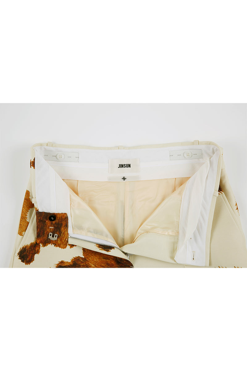 JINSUN printed wool silk Bermuda shorts in pale yellow with a detailed close-up of the fabric and pattern.