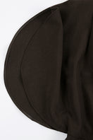 Close-up of JINSUN Filante wool brown jumpsuit showing fabric texture and tailored design details.