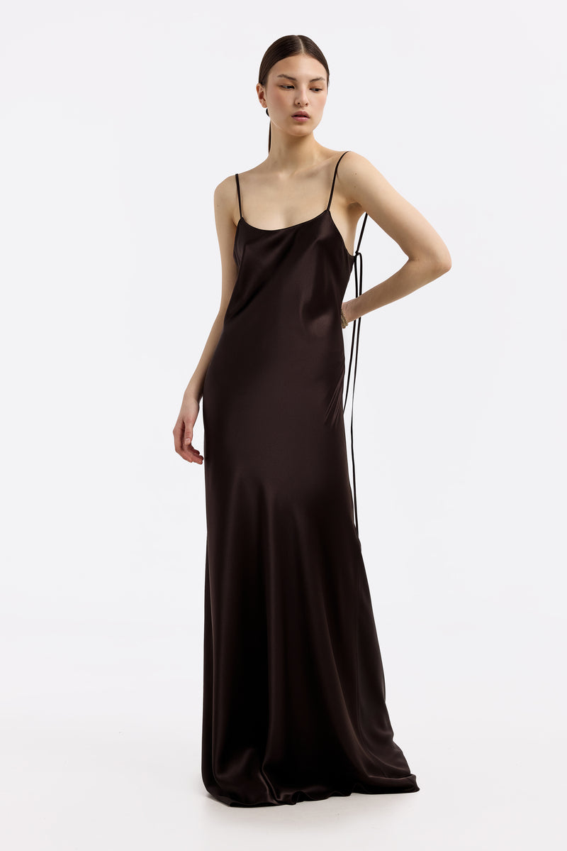 Serenity Devon Espresso low-back silk-satin maxi dress displayed on a hanger, featuring a flowing silhouette and elegant design.
