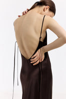 Serenity Devon Espresso silk-satin maxi dress with low back, flowing design, and elegant style, shown on a model.