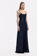 Serenity Devon navy low-back silk-satin maxi dress displayed on a hanger with flowing fabric and elegant design.