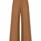 Tan ANA + MARIA PINO pants displayed on a hanger, showcasing their stylish design and fabric texture.