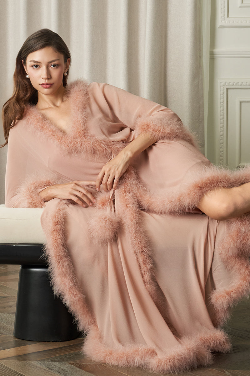 Manito Diva women's feather long robe in coral, flowing fabric with feather details, styled for elegant loungewear.