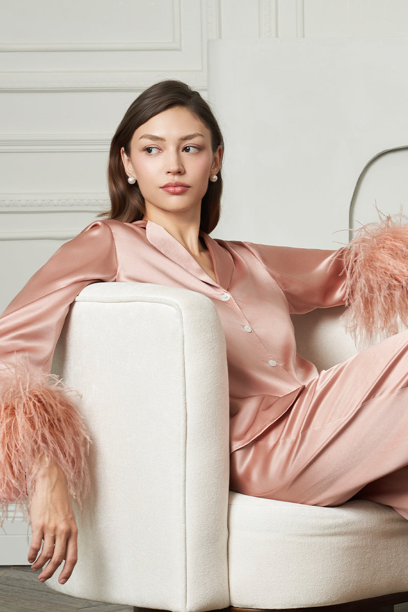 Coral feather-print women's pajama set by MANITO featuring a relaxed fit and soft fabric for comfortable sleepwear.