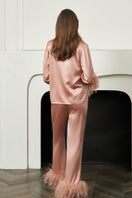 Coral feather-print women's pajamas set by MANITO featuring comfortable, stylish sleepwear with a relaxed fit.