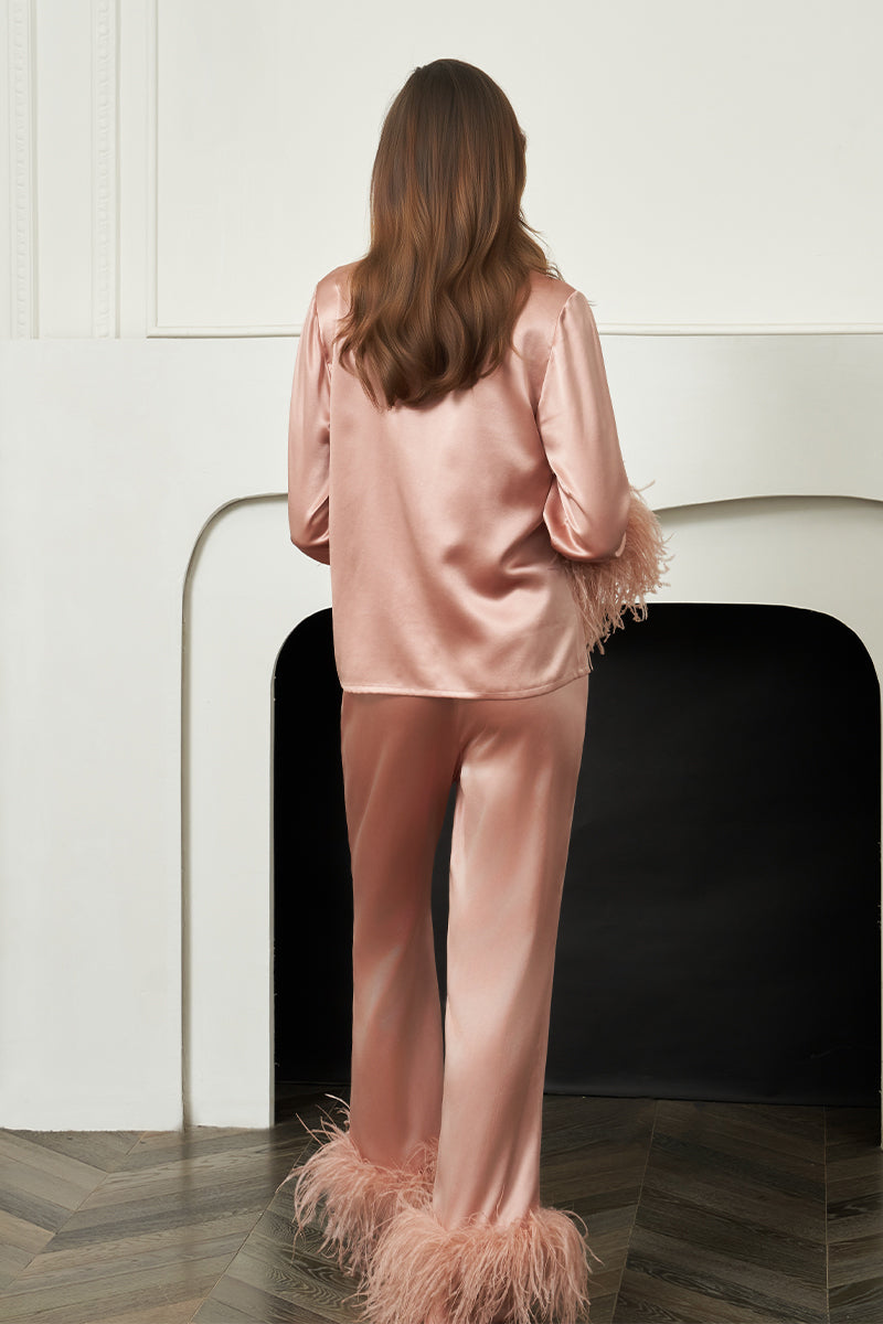 Coral feather-print women's pajamas set by MANITO featuring comfortable, stylish sleepwear with a relaxed fit.