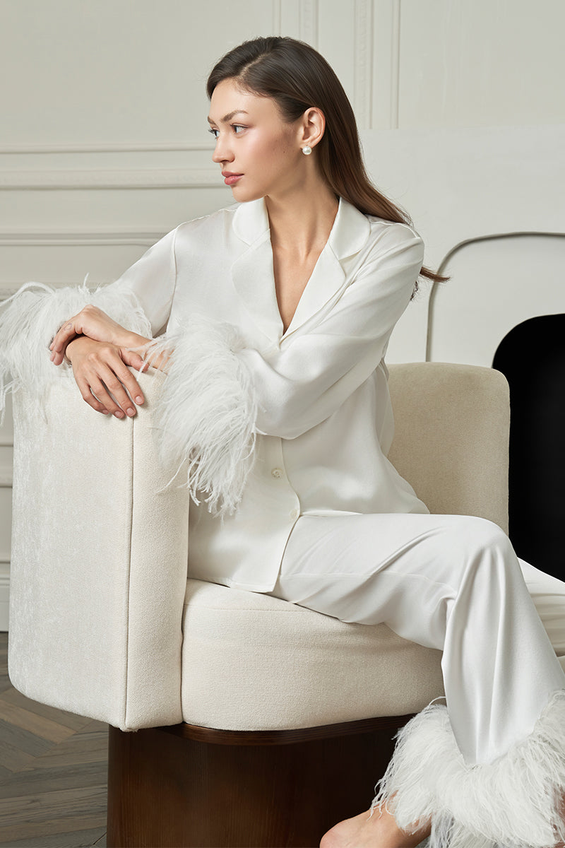 White feather-print women's pajama set by MANITO featuring a comfortable, stylish design for relaxed sleepwear.