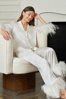White Diva women's feather pajama set by MANITO, featuring soft fabric and elegant feather details for comfortable sleepwear.