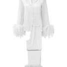 White feather-patterned women's pajama set by MANITO featuring comfortable, stylish sleepwear for relaxation and bedtime comfort.