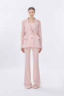 Pink doll suit jacket from Stolen Stores featuring a classic long pants design, shown front view on a mannequin.