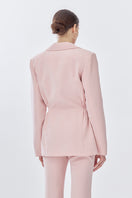 Pink doll suit jacket from Stolen Stores, stylish jacket with tailored fit and detailed design, shown from the back.