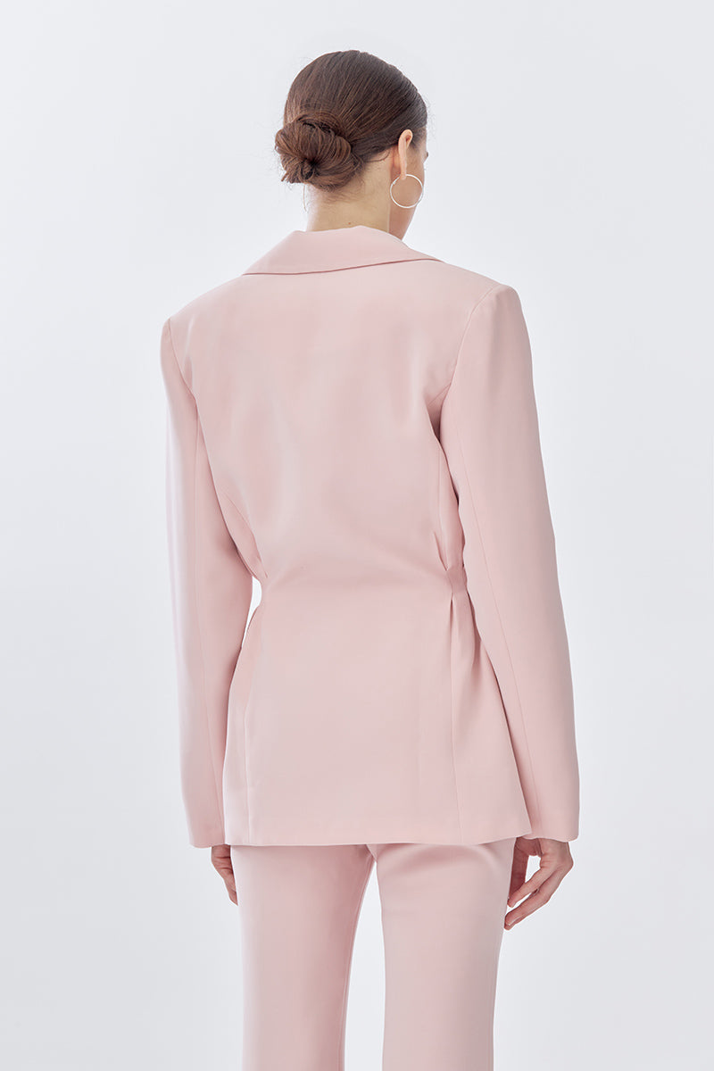 Pink doll suit jacket from Stolen Stores, stylish jacket with tailored fit and detailed design, shown from the back.