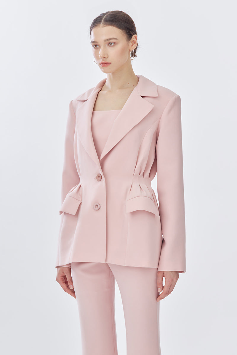 Pink doll suit jacket from Stolen Stores, stylish front view showcasing the tailored design and vibrant color.