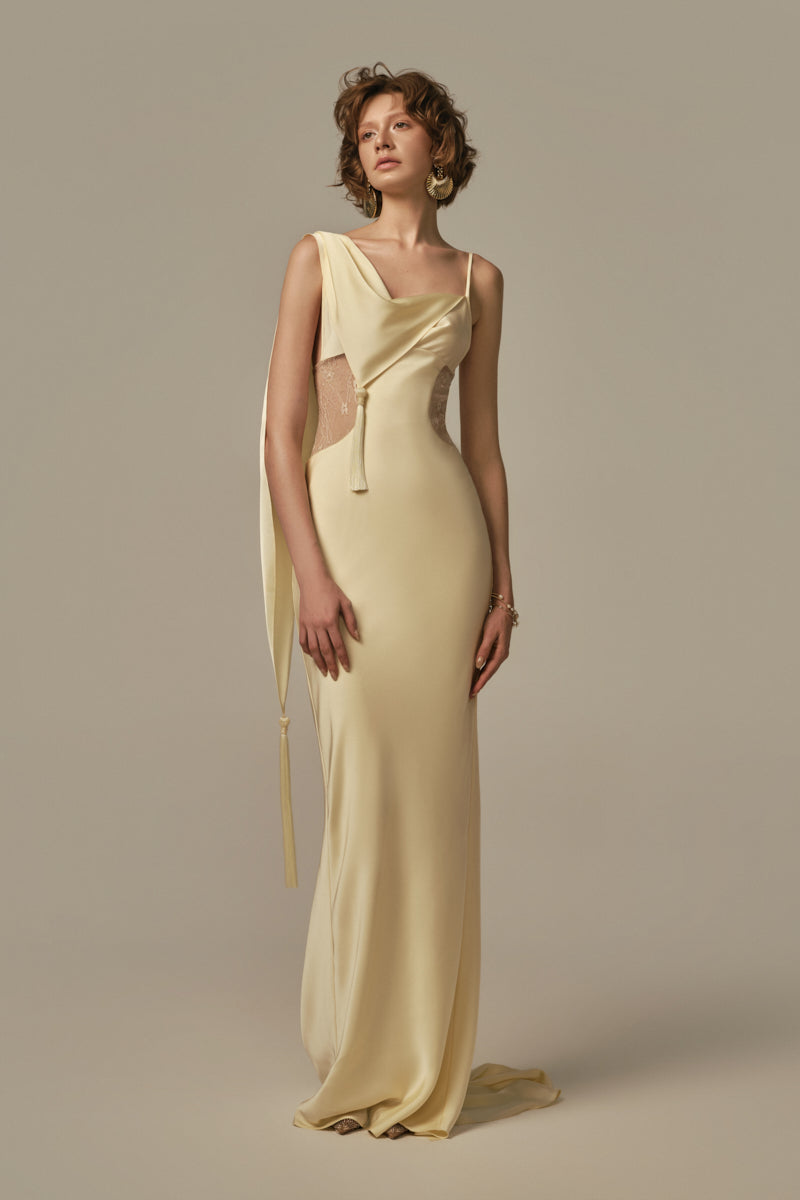 Pastel yellow POEM dormeuse gown displayed on model, featuring flowing fabric and elegant design for comfortable wear.