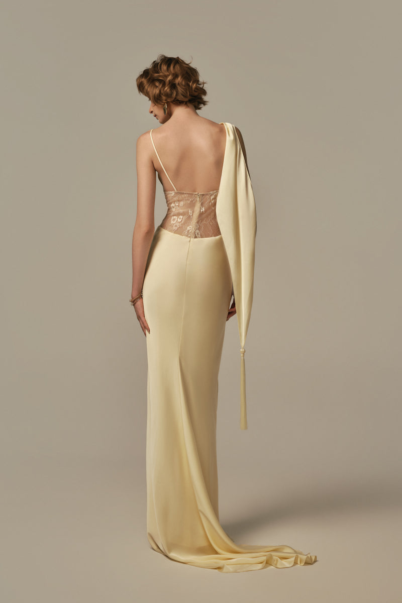 Pastel yellow Poem dormeuse gown displayed on model, featuring a flowing, elegant design perfect for relaxed, stylish wear.