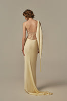 Pastel yellow DORMEUSE gown by POEM featuring a flowing design, displayed on a model with soft, elegant fabric.