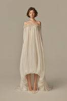 White POEM Douceur Maxi Dress displayed on model, showcasing flowy fabric and elegant design perfect for stylish summer wear.