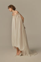 White POEM DOUCEUR MAXI DRESS on model, flowing fabric, elegant design, full-length style perfect for summer or formal occasions.