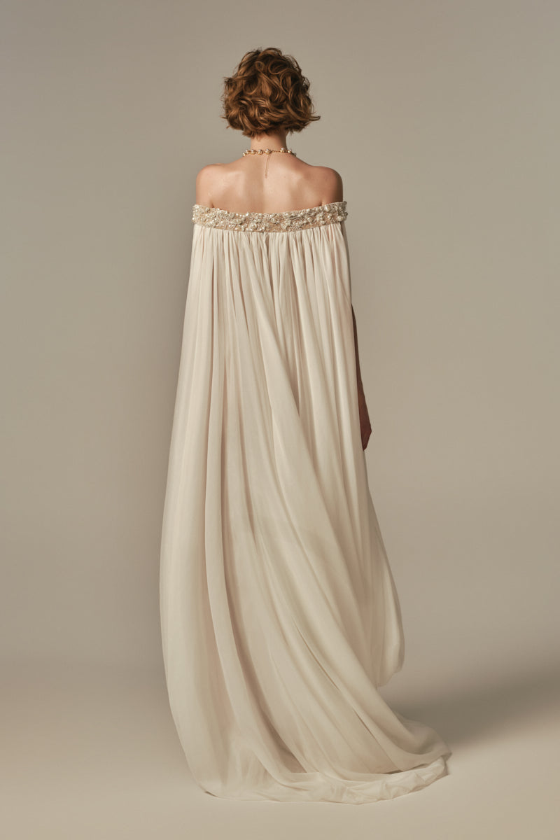 White POEM Douceur Maxi Dress worn by model, flowing fabric, elegant design, perfect for casual or formal occasions.