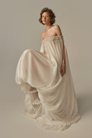White POEM Douceur Maxi Dress worn by model, flowing fabric, elegant design, perfect for casual or formal occasions.
