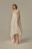 White POEM Douceur Maxi Dress worn by model, featuring flowing fabric and elegant design, perfect for summer or formal occasions.