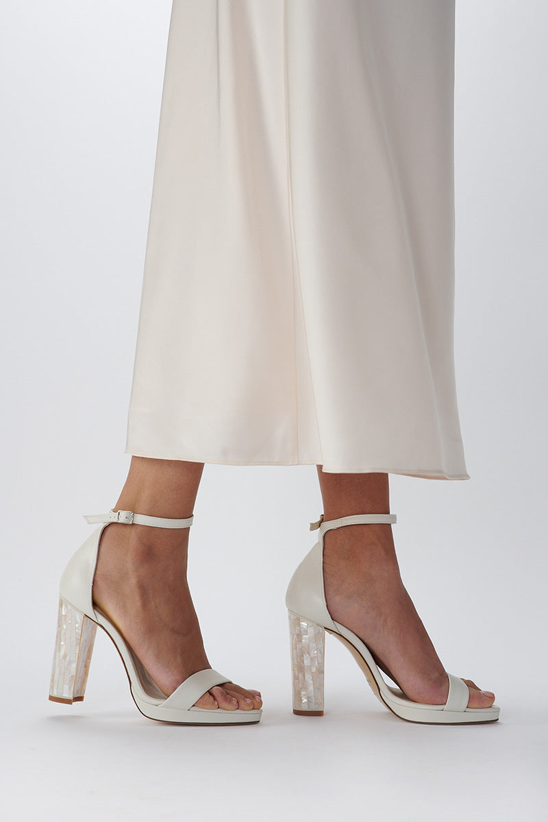 Elegant dove-gray heels by Freya Rose featuring sleek design and pointed toes, displayed on a neutral background.