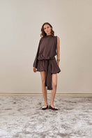 YASSMIN SALEH brown drape top with flowing fabric, front view showcasing elegant neckline and stylish design.