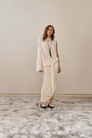 YASSMIN SALEH ivory drape top with elegant front design, showcasing soft fabric and stylish neckline.