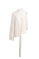 Ivory drape top by Yassmin Saleh featuring a flowing, elegant design with soft fabric and stylish front draping.