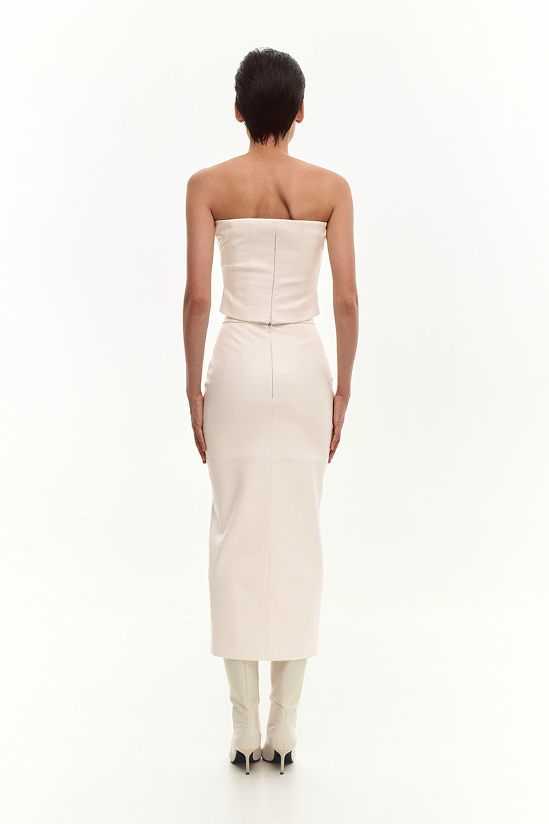 Back view of KRIS MARÁN FIT CUT midi skirt with front cut in ecru, showcasing the draped design and stylish silhouette.