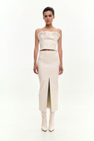 KRIS MARÁN vegan leather draped top in ecru, featuring a stylish front drape and elegant design.