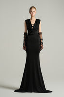 Black V-neck sleeveless gown by I.H.F Studio, featuring a draped cowl neckline and flowing jersey fabric.