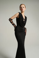 Black V-neck sleeveless gown by I.H.F Studio with draped cowl neckline and flowing jersey fabric.