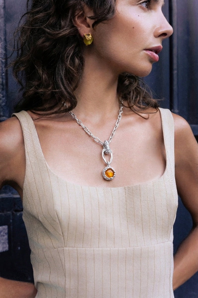 Orange rhodium drape pendant necklace with house chain from Jude Benhalim, elegant jewelry for stylish accessories.