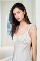 White silk chemise nightgown for women by MANITO, featuring a smooth, luxurious fabric and delicate design.