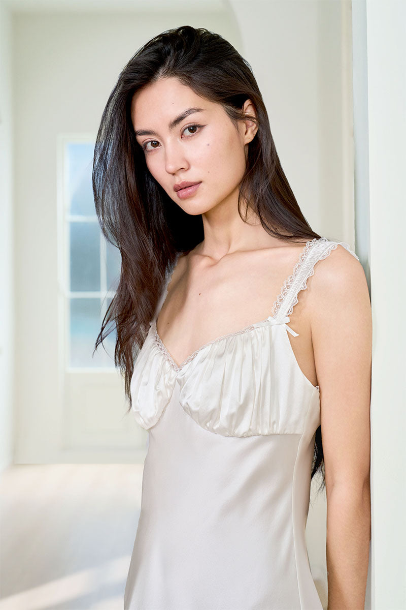 White silk chemise nightgown for women by MANITO, featuring a smooth, luxurious fabric and delicate design.