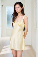 Yellow silk chemise for women by MANITO, featuring a smooth, luxurious nightgown with delicate straps and elegant design.