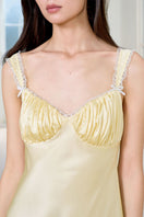 Yellow silk chemise nightgown for women, by MANITO, featuring smooth fabric and delicate straps.