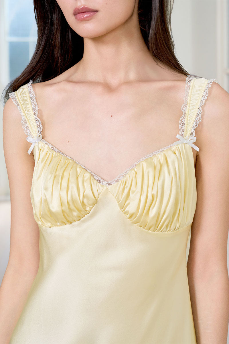 Yellow silk chemise nightgown for women, by MANITO, featuring smooth fabric and delicate straps.