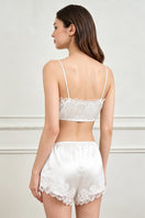 White silk lingerie set for women by MANITO, featuring elegant pajama design with delicate fabric and comfortable fit.