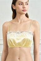 Yellow silk lingerie pajama set for women by MANITO, featuring a comfortable, elegant design with delicate fabric and stylish details.