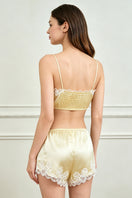 Yellow silk lingerie pajama set for women by MANITO, featuring a soft, luxurious fabric and elegant design.