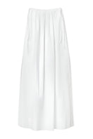 Seaquelle Drift Maxi Skirt in flowy fabric, photographed hanging, showcasing its long, elegant design and lightweight material.