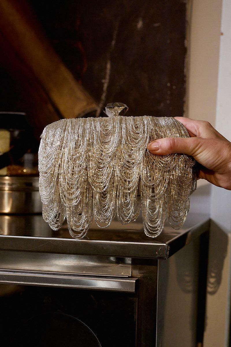 Silver drip clutch purse by Sarah's Bag, stylish silver box clutch with a drip design, perfect for evening occasions.