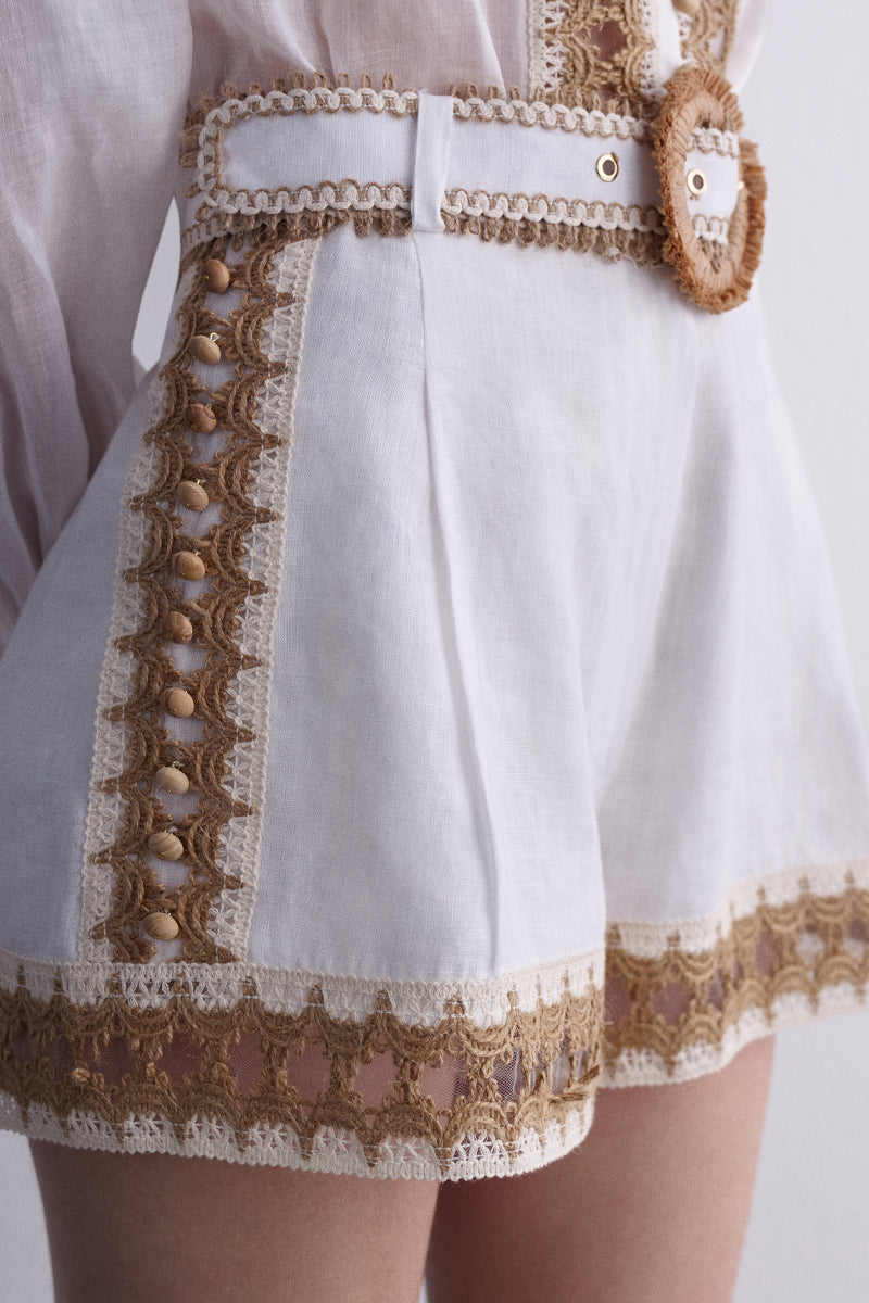 White natural Dune pants by AISA, showcasing the stylish fit and fabric texture in a close-up image.